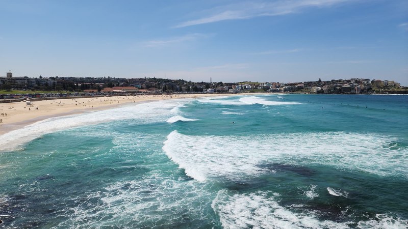 Bondi Beach from the coastal path with surf breaking across the bay