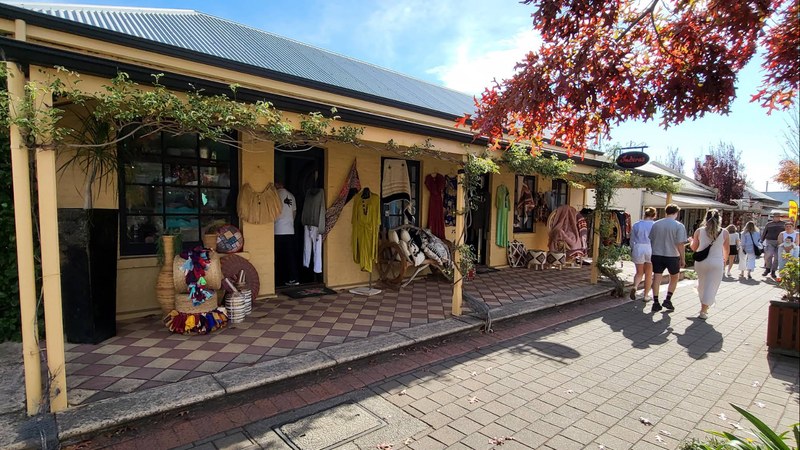 Hahndorf main street shopfronts with verandas and autumn foliage in the Adelaide Hills